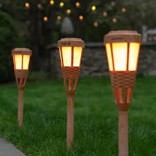 garden patio torches light up lawn