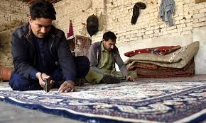 stani workers make carpets in