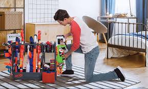 I don't know about your children, but my son has an abundance of nerf guns. Amazon Com Nerf Elite Blaster Rack Storage For Up To Six Blasters Including Shelving And Drawers Accessories Orange And Black Toys Games