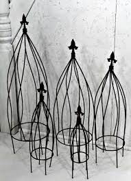 Our collection includes arbors, screens and garden arches in cedar as well as classic metal trellises in steel. Wrought Iron Twist Flower Trellis Small Obelisk
