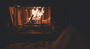 A Fireplace Burning At Night