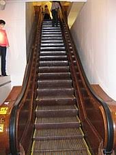 The steps run on tracks. Escalator Wikipedia