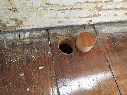 how to plug a hole in a wooden floor