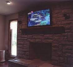 Flat Panel Tv Above Bricked Fireplace