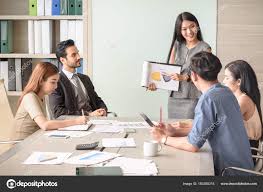 Businesswoman Present Financial Chart With Team In The