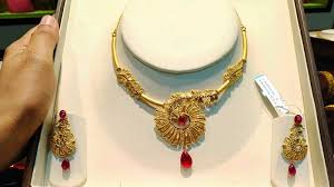 tanshiq gold necklace set designs with