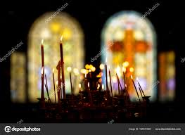 Stained Glass Windows In Church And Candles Stock Photo