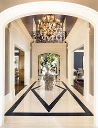 Marble flooring would be an interesting choice for a luxurious effect, but you can add marble surfaces to your foyer with wallpaper or a vanity with a marbled top. Black And White Marble Foyer Floor Novocom Top