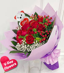 12 red roses with free bear in hand