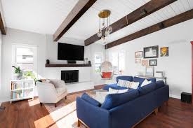 living room with everything faux wood beams