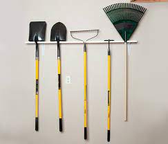 Although the one depicted was custom built for kayaking, it shows you how easy it is to build one just like it for your garden tools. How To Build A Garden Tool Rack In 5 Easy Steps Diy Stanley Tools