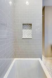 This tiny bathroom is made to feel much larger by the inclusion of mirror all around the room. Chevron Shower Niche With Marble Shelf The Ransom Company Guest Bathrooms Guest Bathroom Guest Bathroom Small
