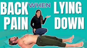 my back hurts when i lie on my back