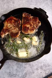 garlic er pork chops in a cast iron