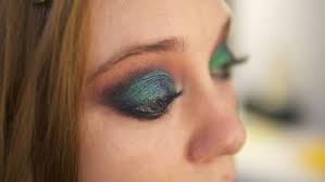 eye makeup woman spreads the eyeshadow