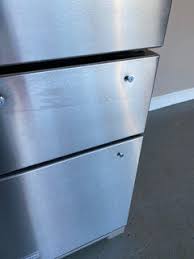 sticker on stainless steel refrigerator