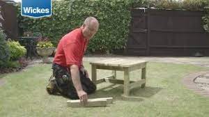 a garden bench and table with wickes