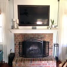 how i painted my brick fireplace black