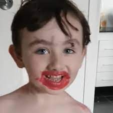 little boy covered in makeup loves