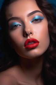 a woman with red lips and blue eyes