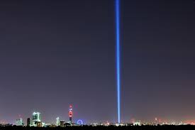 giant light beam rises over london for