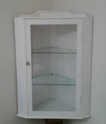 white wall mounted corner cabinet for