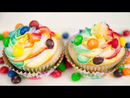 skittles cupcakes with rainbow icing