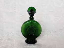Perfume bottle is meant to be refilled over and over so you can keep it forever. Vintage Green Glass Embossed Face Perfume Bottle Hat Stopper Aunt Gladys Attic