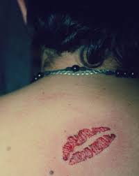pority of kiss lip tattoo among