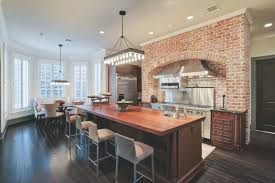Gourmet Kitchen With Exposed Brick Wall