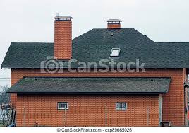 Similarly, how do you match roof color with brick? Facade Of A Private House Made Of A Red Brick Wall With Small Windows Under A Black Tiled Roof With Chimneys Against The Sky Canstock
