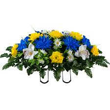 Check out this gorgeous cemetery headstone saddle in shades of purple, & yellow it's made with sunflowers, peonies, mum's, roses, hydrangea's, daisies, marigold's, & lilies its loaded with greenery, & filler flowers that make this saddle absolutely beautiful and very full. Sympathy Silks Artificial Cemetery Flowers Blue Yellow Orchid Mix Saddle For Headstone Walmart Com Walmart Com