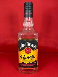 empty jim beam honey whiskey glass