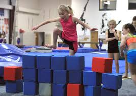 In ninja classes, children are constantly working against gravity with the force of their weight to move their bodies. Parkour Ninja Classes Greenville Gymnastics