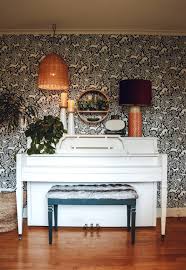 painted piano and wallpaper accent wall