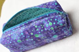 dozens of you who turned that wristlet into a coin purse cosmetic bag diaper wipes bag etc you also requested a box version of the zippered pouch