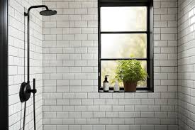 A White Subway Tiled Shower With A