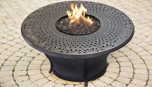 This fire pit has a steel frame in black finish and a faux wood table top crafted from cast stone. Charleston 48 Inch Round Cast Top Gas Fire Pit Table