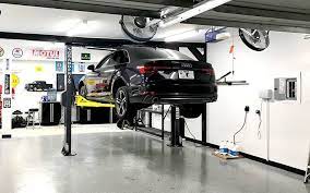 The car lifts reviewed here make for great tools in a home garage for several reasons, including affordability and ease of use. This 2 Post Lift Is Designed For Average Home Garages That Don T Have Much Ceiling Height This Lift Is Only 8 F Garage Car Lift Garage Design Diy Garage Plans