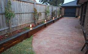 build raised garden bed along fence