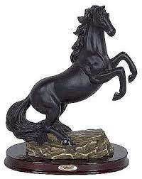 This is a bay brown horse figurine. Black Horse Stallion Sculpture And Statue