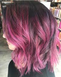 Attractive woman with pink hair and makeup with glitter looking away isolated on violet. Bubblegum Pink Hair Inspo And How To Maintain It At Home Chatters Hair Salon