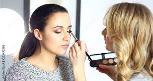 professional makeup artist working with