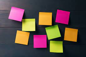 blank colorful sticky notes on wooden