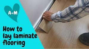 lay interlocking laminate flooring