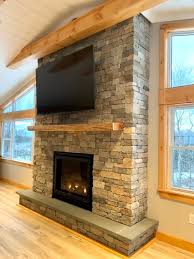 A New Stone Veneer Fireplace Comes