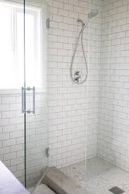 white subway tiles with gray grout in