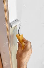 We also share our favorite painting tools to give you that professional finish. Hand With Roller Painting A Wooden Door Frame Stock Photo Picture And Royalty Free Image Image 30713213