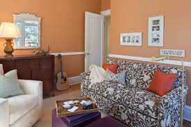 eclectic family room with orange walls