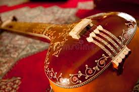 end of a wooden tanpura stock image
